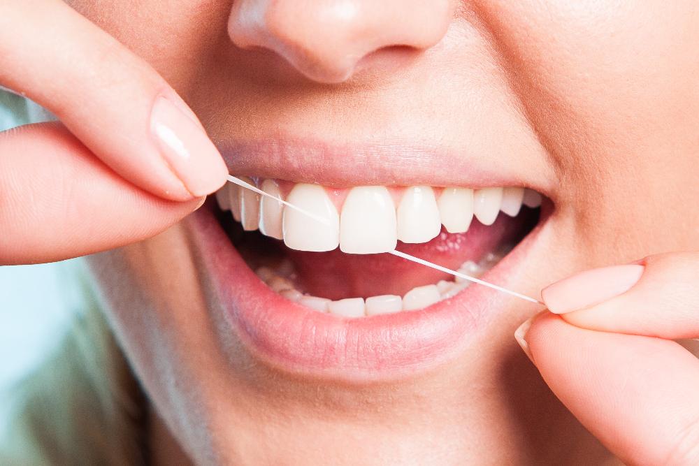 A woman flossing