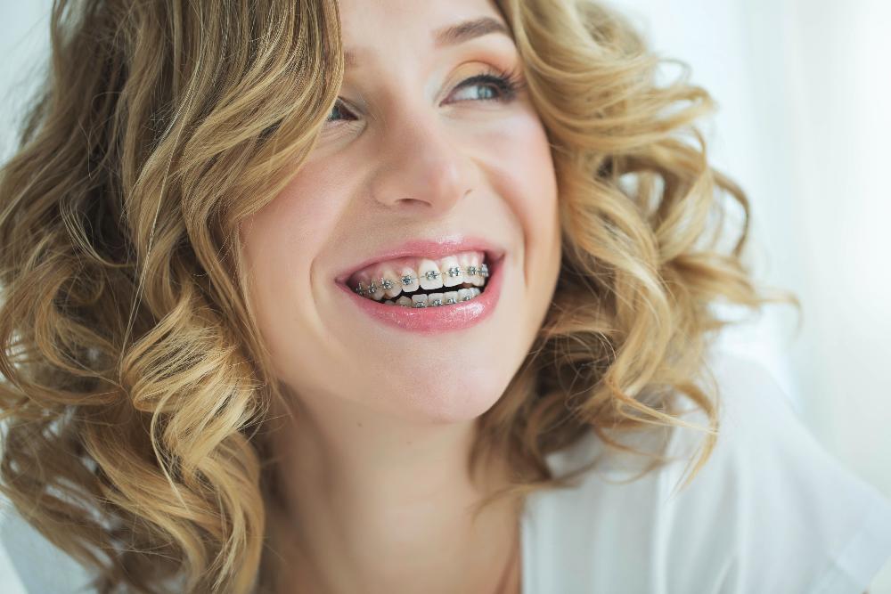 A smiling woman with braces in Kurri Kurri