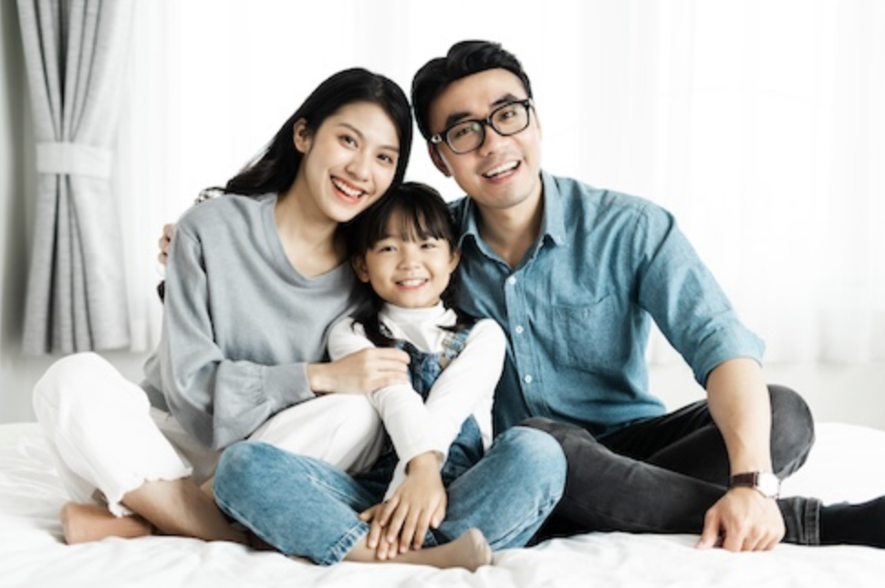 A smiling family sitting together