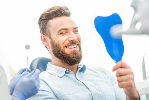 A smiling man at the dentist's office