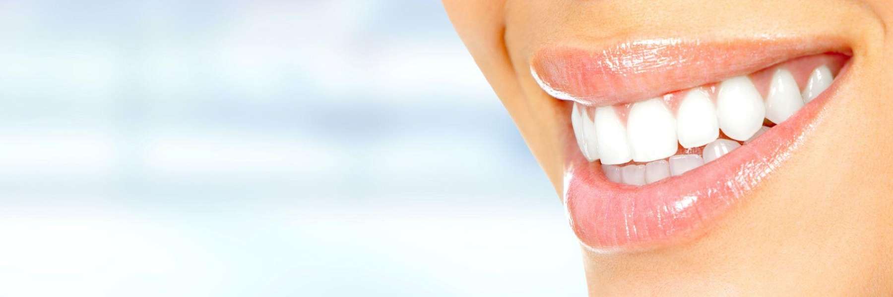 A smiling woman with white teeth