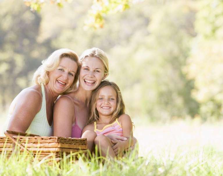 A laughing family having a picnic